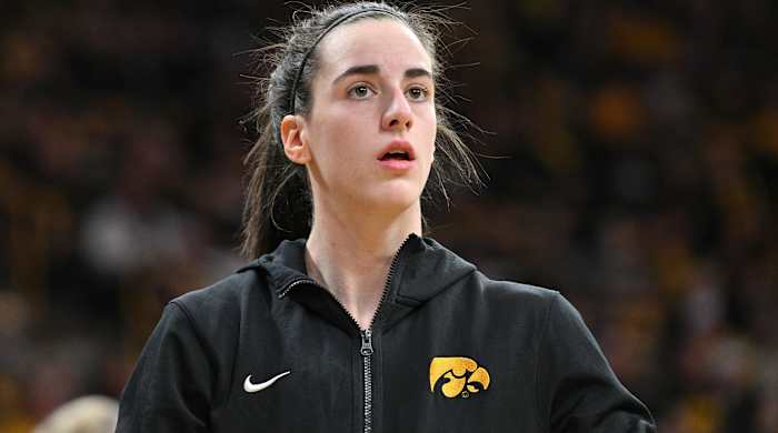 Iowa star Caitlin Clark looks on while warming up before a game.